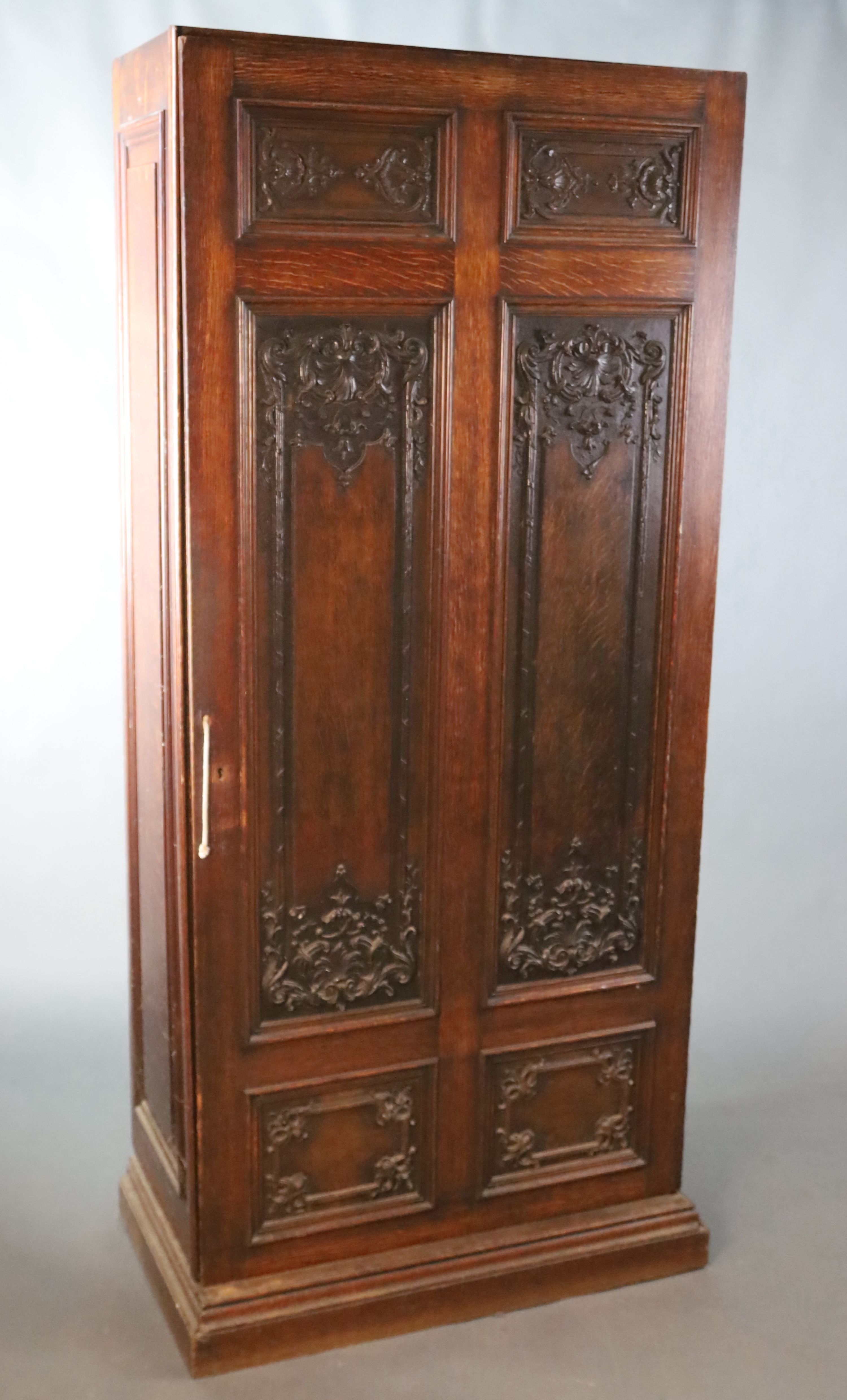 A late 19th century French oak hall cupboard, W.119.5cm D.51cm H.200.5cm